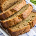 Freshly baked gluten free zucchini bread sliced on a plate