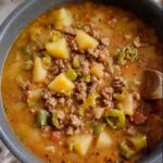 Hatch Green Chile Stew with Ground Beef in a bowl with potatoes and chiles