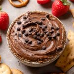 brownie batter dip in a bowl topped with mini chocolate chips