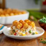Close-up of Chicken Tot Pie served on a plate with golden tater tots and creamy filling